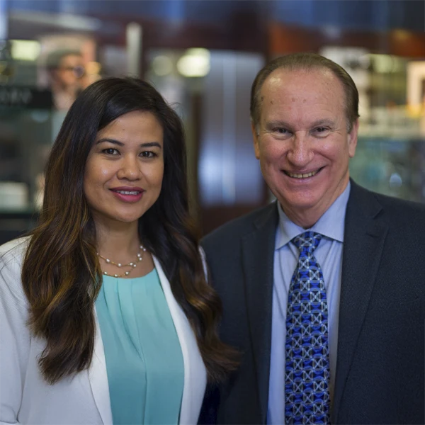 Dr. Thear Bun and Dr. Michael C. Morris standing together in a professional office environment.